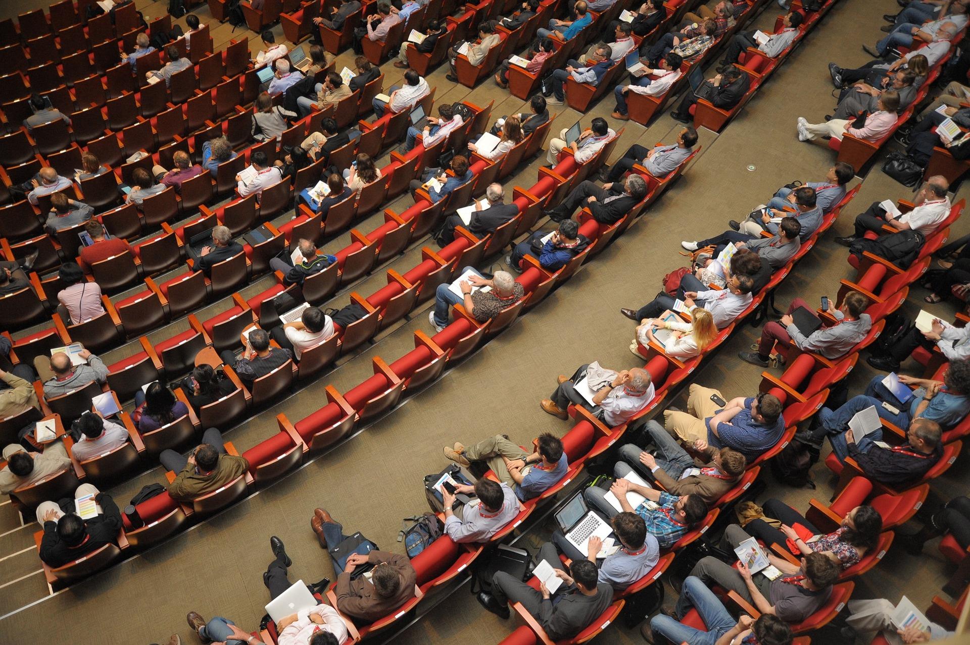 Ariel view of people sitting in an auditorium Ariel view of people sitting in an auditorium